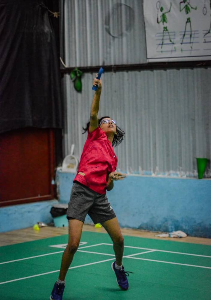 Player jumping for an overhead smash