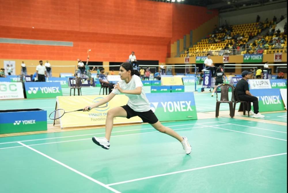 Player lunging for a shot at a tournament arena