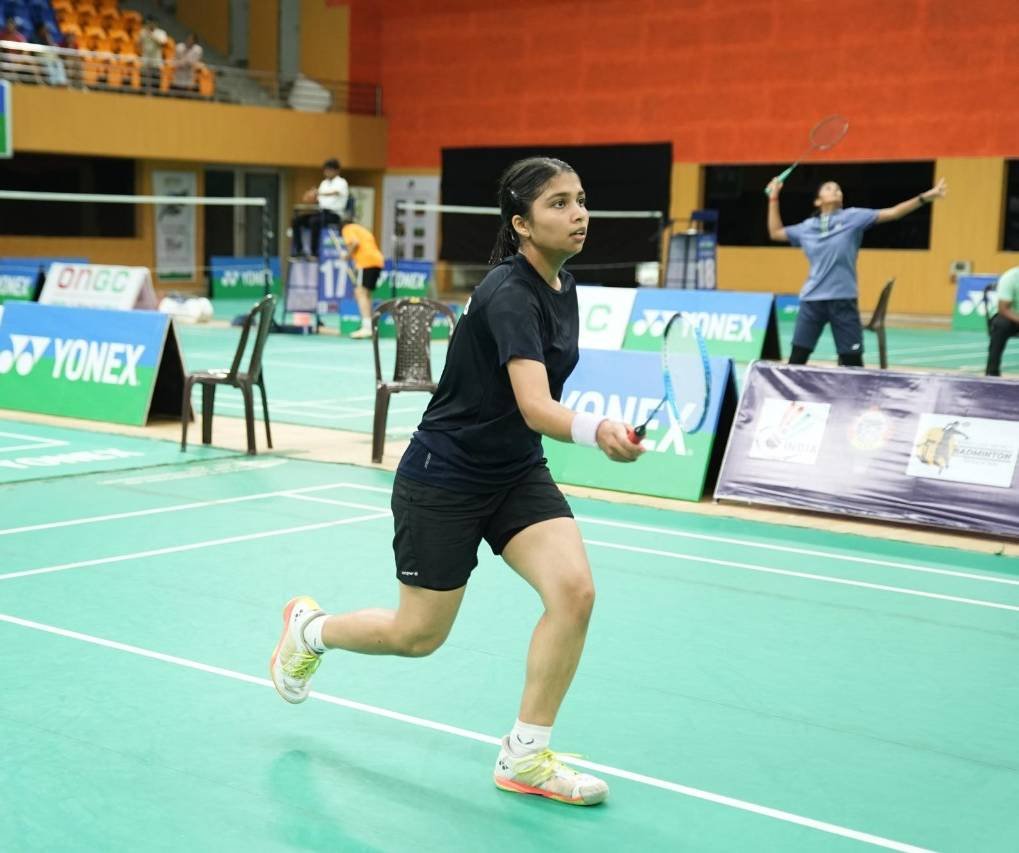 Player sprinting across the court during a rally