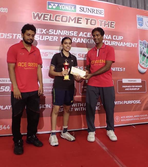Player receiving a trophy and certificate at a tournament