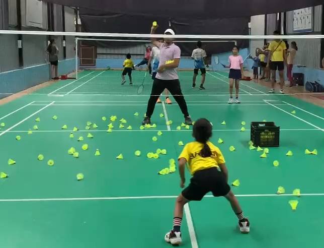 Kids badminton coaching session